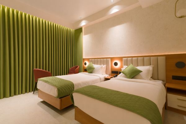 Deluxe twin hotel room at The Crystal Palace Hotel in Changanassery
